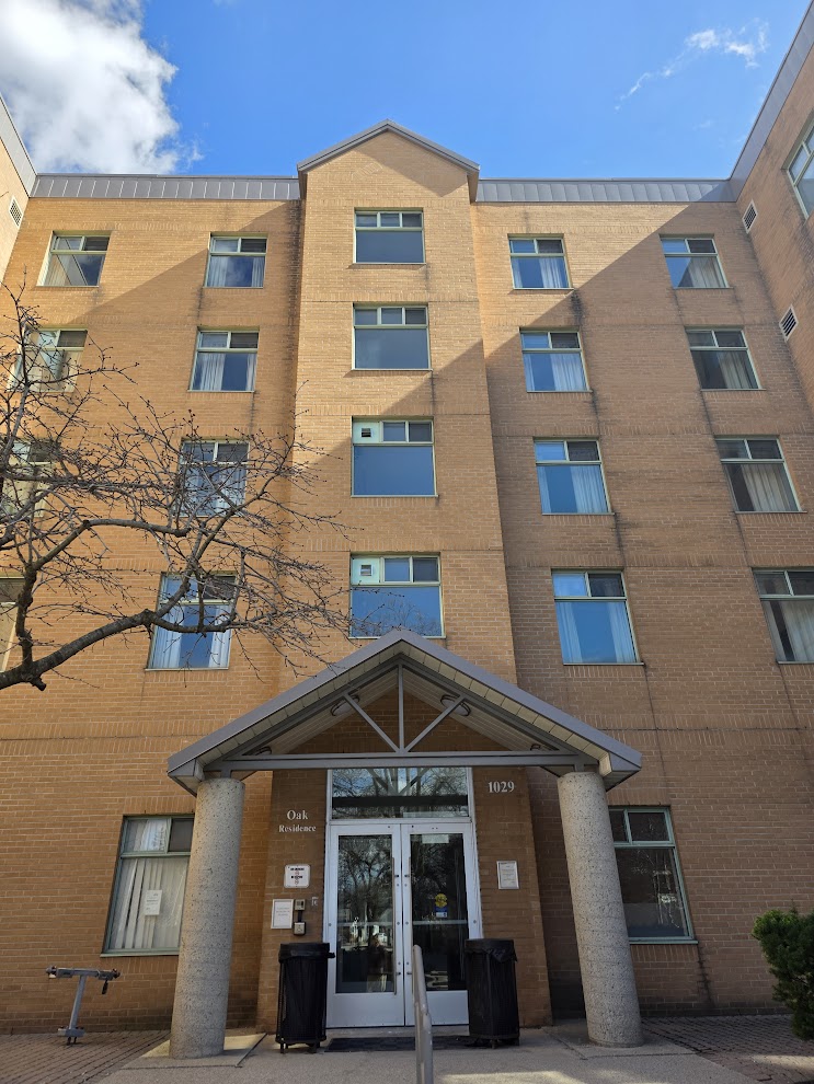Exterior view of the secure 1029 Main Street West female student housing building located in Hamilton (Westdale) near McMaster University.