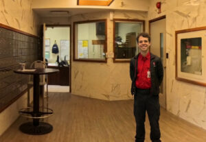 Brightly lit secure building lobby with 24/7 security service.